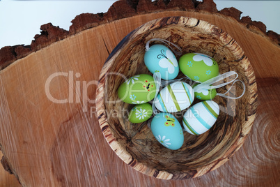Colorful eggs - wooden background