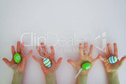 Hands with colorful eggs 2