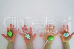 Hands with colorful eggs 2