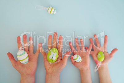 Hands with colorful eggs 4