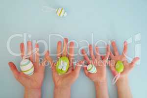 Hands with colorful eggs 4