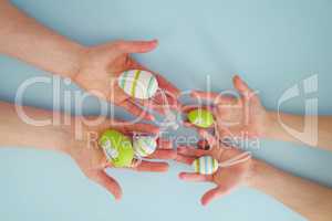 Hands with colorful eggs 5