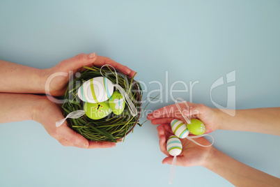 Hands with colorful eggs 6