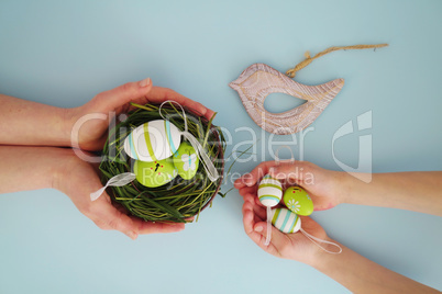 Hands with colorful eggs 7