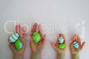 Hands with colorful eggs
