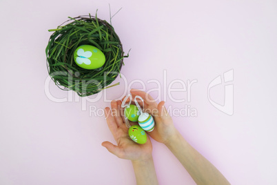 Kids hands with colorful eggs