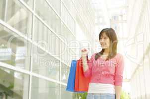 Asian woman with shopping bags