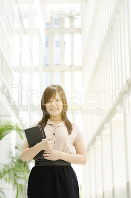Young Asian woman executive smiling