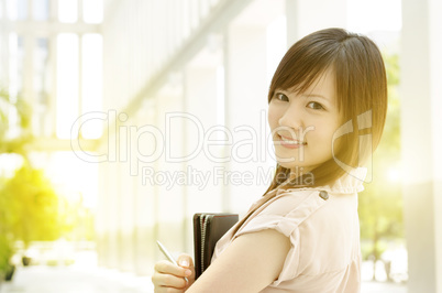 Young Asian female executive at office
