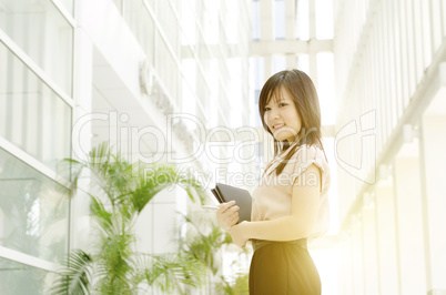 Young Asian woman executive at office