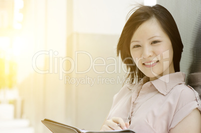Portrait of young Asian woman executive
