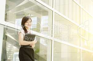 Young Asian woman executive smiling
