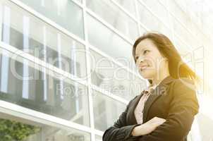 Young Asian business woman looking away