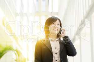 Young Asian business woman on the phone