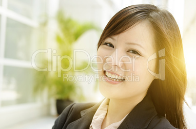 Cheerful young Asian business woman