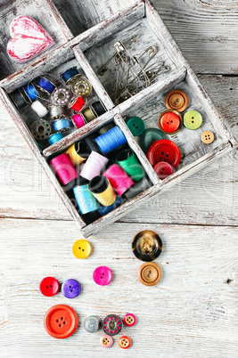 Buttons and spool of thread