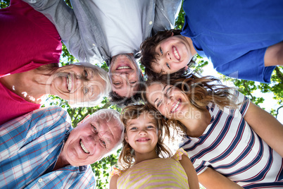 Smiling family with their heads in a circle