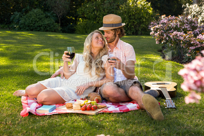 Happy couple having a picnic and embracing