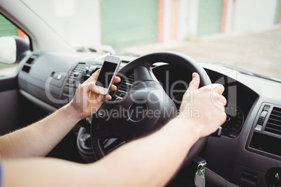 Delivery man driving his van