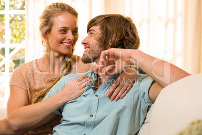 Cute couple hugging and resting on the couch