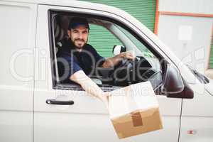 Delivery man sitting in his van