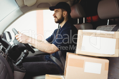 Delivery man driving his van