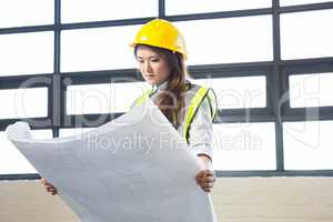 Architect looking at blueprint