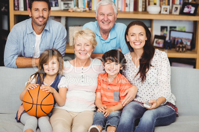 Portrait of smiling family watching basketball match