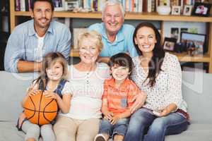 Portrait of smiling family watching basketball match