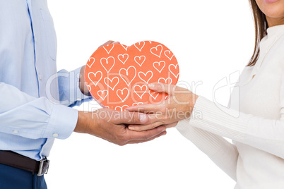 Cute couple holding box with hearts