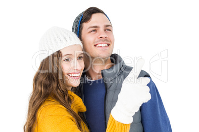 Smiling couple pointing and looking away