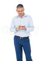 Thoughtful businessman using smartphone