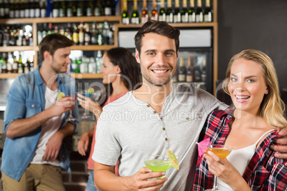 Couple toasts with cocktails