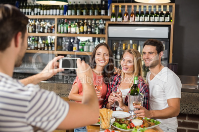 Man taking picture of friends