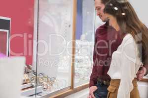 Couple looking at display of watches