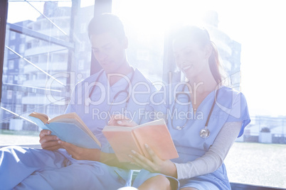 Medical team reading book