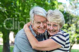 Senior couple embracing head to head