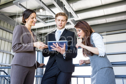 Three colleagues discussing in office