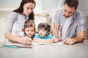 Family writing in book