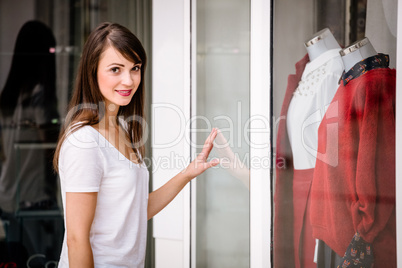 Portrait of beautiful woman window shopping