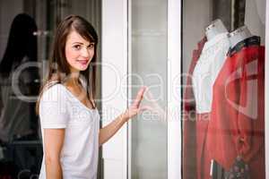 Portrait of beautiful woman window shopping