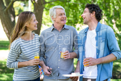 Family having a picnic with barbecue