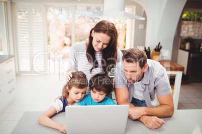 Family working on laptop