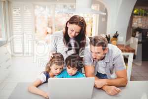 Family working on laptop