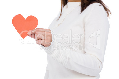 Cheerful brunette holding paper heart