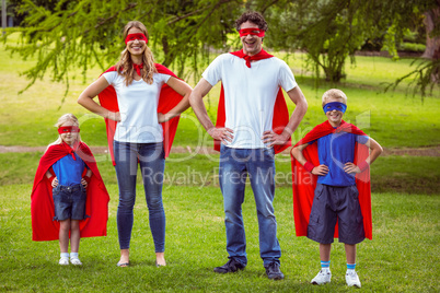 Happy family pretending to be superhero