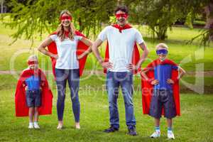 Happy family pretending to be superhero