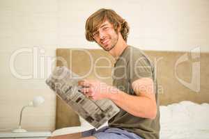 Handsome man reading a newspaper