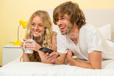 Cute couple watching TV