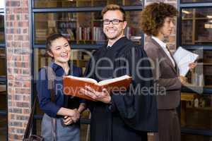 Lawyer and businesswoman standing near library